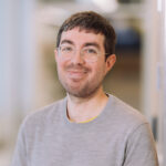 Daniel Anderson, Jetico Content Marketing Specialist and News Writer, smiling and wearing a gray sweater and glasses.