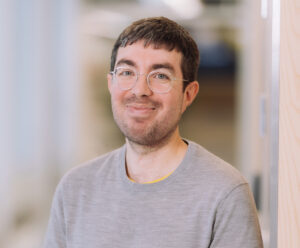 Daniel Anderson, Jetico Content Marketing Specialist and News Writer, smiling and wearing a gray sweater and glasses.